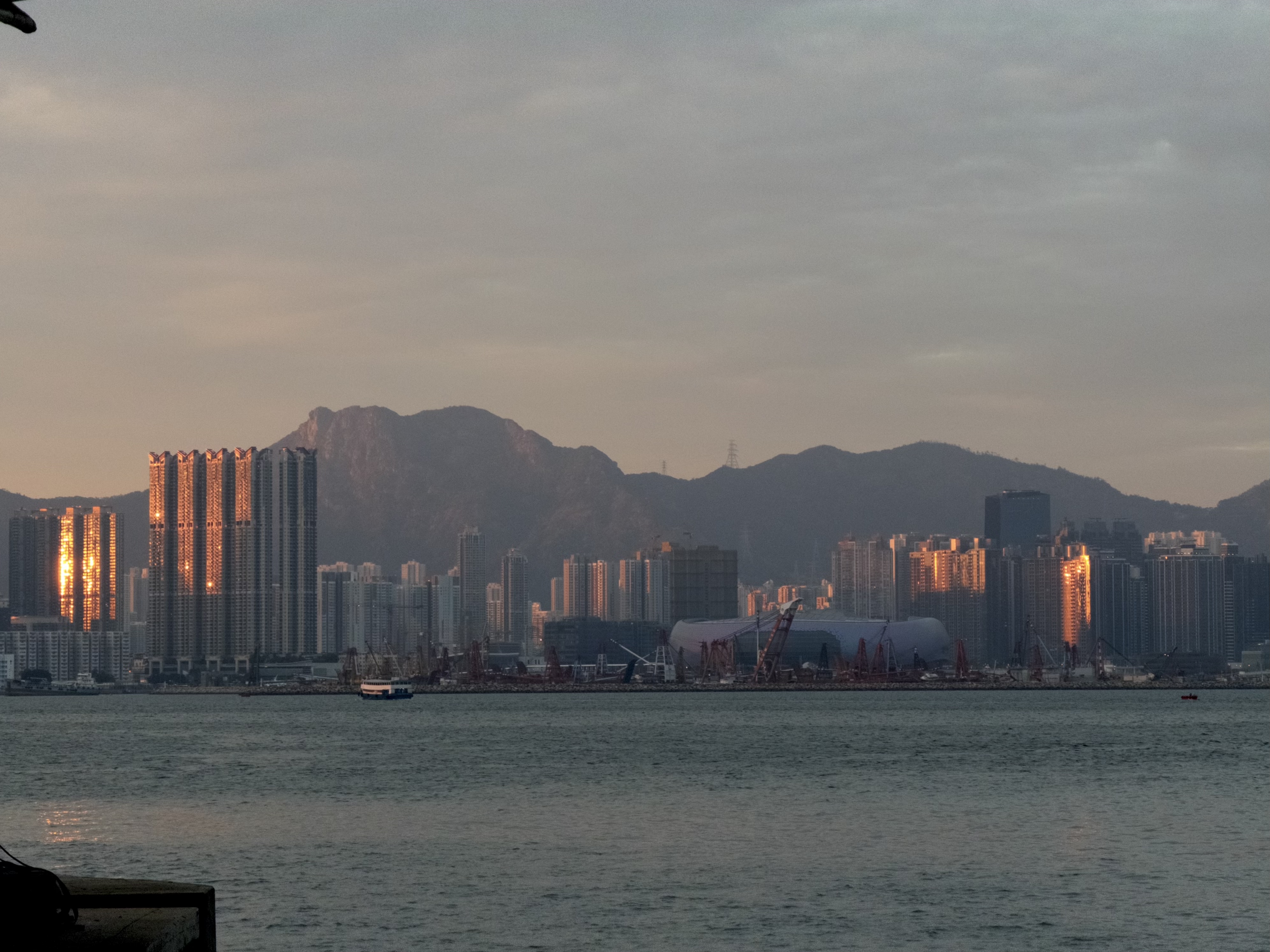 A waterfront city at sunset, photographed and developed with LUMA